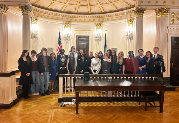 Members of the Mock Trial team and their advisers pose in the courtroom