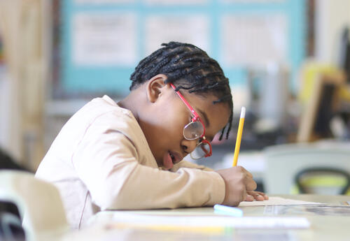 Student working on a writing assignment