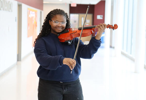 Harvey holding her violin