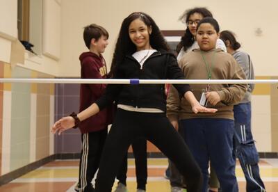 Students play the limbo game at a No Referral Celebration.