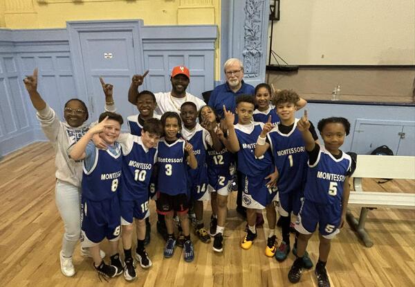 A group shot of a basketball team after a game.