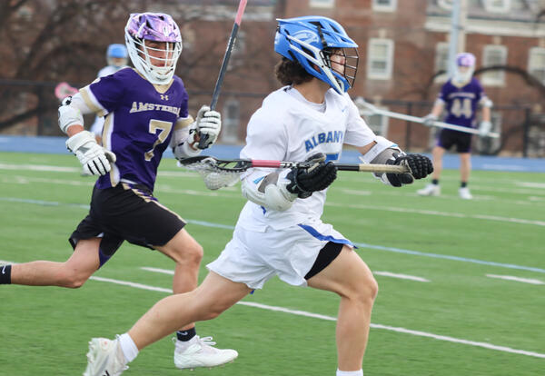 Albany High player running with the ball