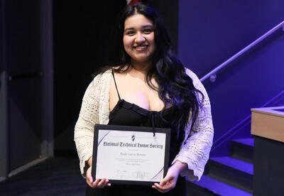 Student receiving her induction certificate