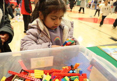 student looking at blocks