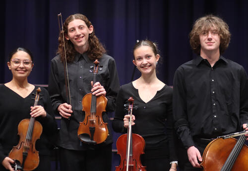 Members of the Falcon Consort posing with their instruments