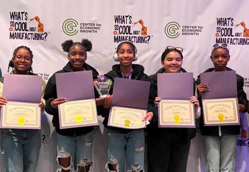 Students pose with awards certificantes.