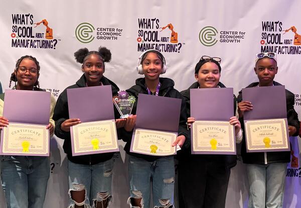 Students pose with awards certificantes.