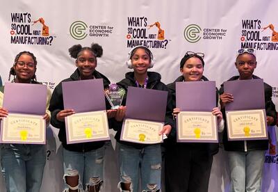 Students pose with awards certificantes.