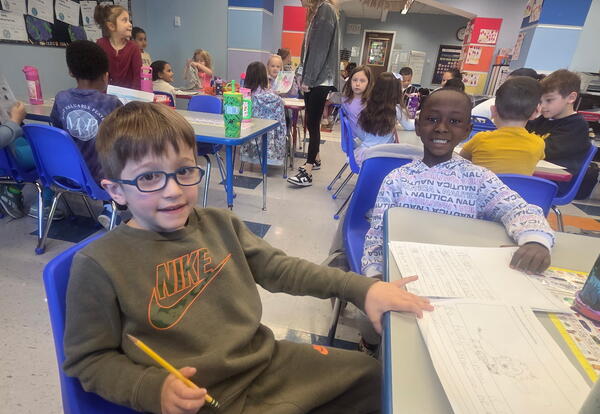 Students share work from a unit on animals.