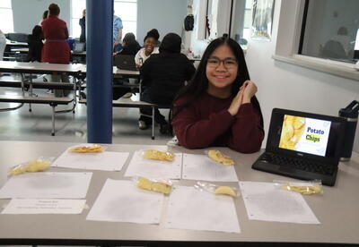 A student presents her science project.