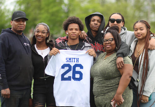 Nasief Smith posing for a photo with his family