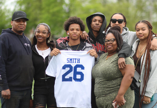 Nasief Smith posing for a photo with his family