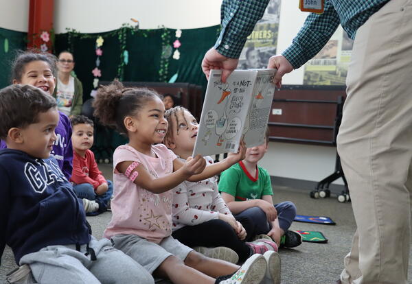 kids looking at book