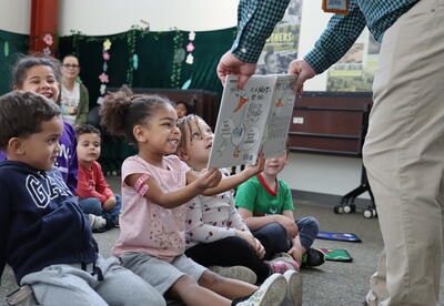 kids looking at book