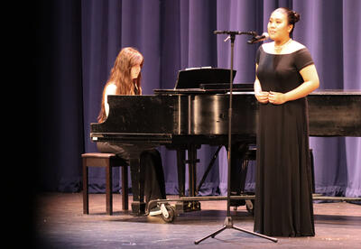 Anna Ustin and Celine Casasola performing on stage