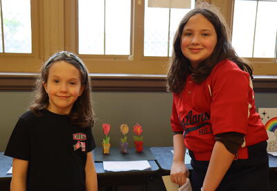 Students posing infront of art
