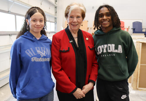 Commissioner Reardon with two construction technology students