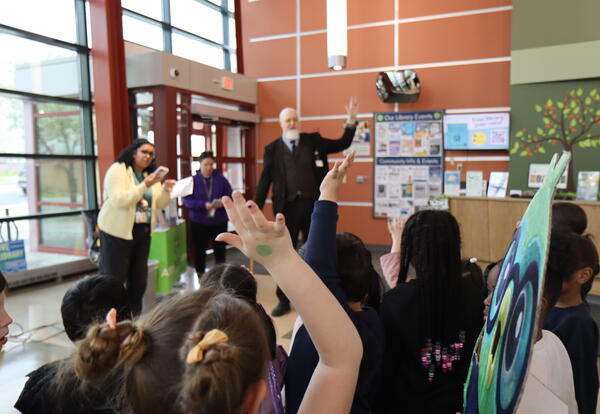 kids raising their hands
