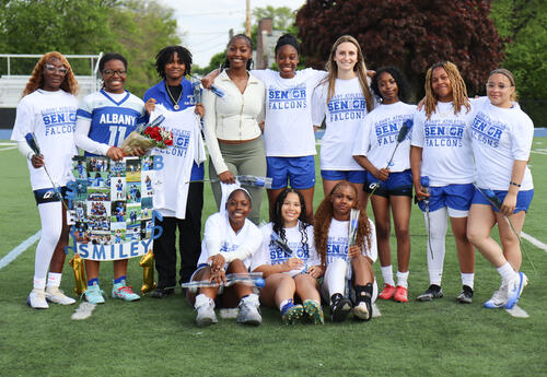 Group picture of seniors on the turf field