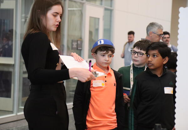 Students present research during a science fair.