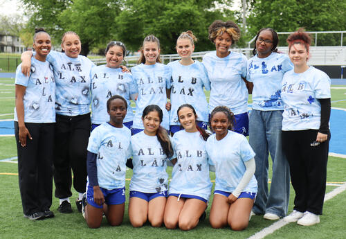Group picture of seniors on the turf field