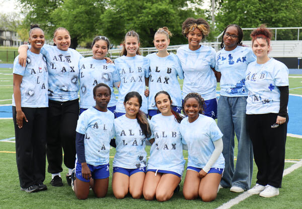 Group picture of seniors on the turf field