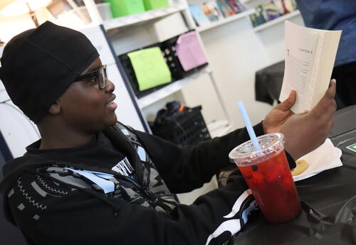 A student reads a book in ELA class.