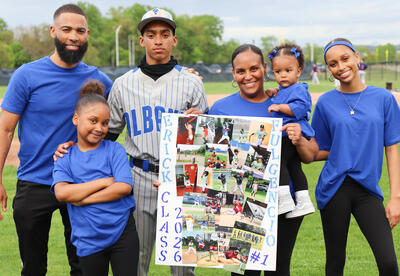 Erick Fulgencio with loved ones on the baseball field