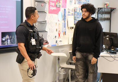 Image of student speaking with Officer Schuler during the lesson