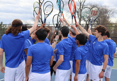 Group shot of tennis players with rackets