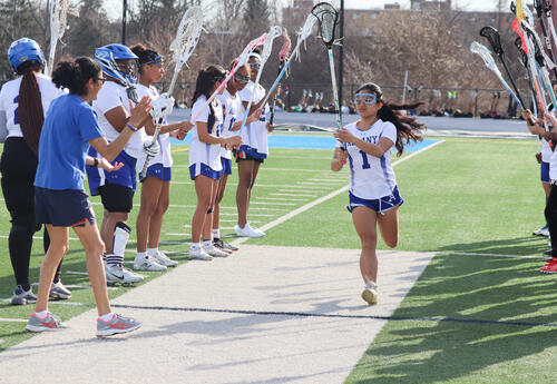 Albany High scholar-athlete Rikamae Ann Ayahao preparing to take the field for a lacrosse game