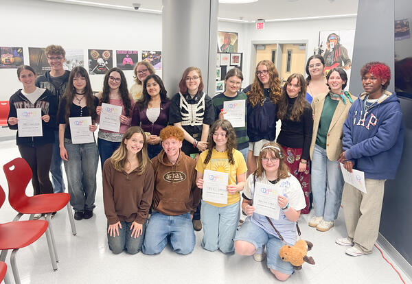 New inductees with certificates and returning club members