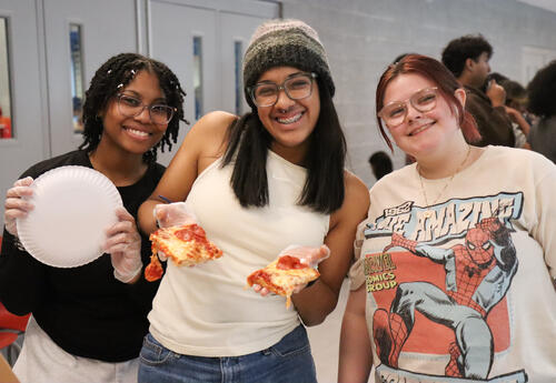 Photo of three students at the event