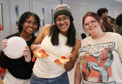 Photo of three students at the event