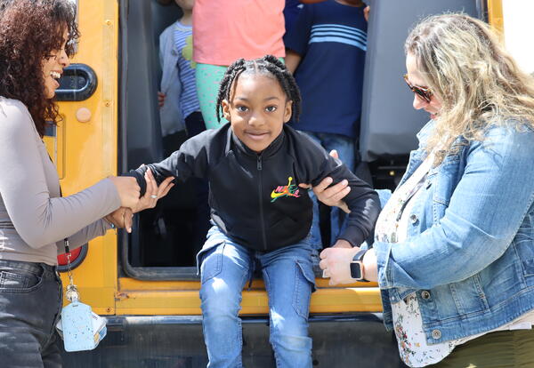 A student practices a bus evacuation.