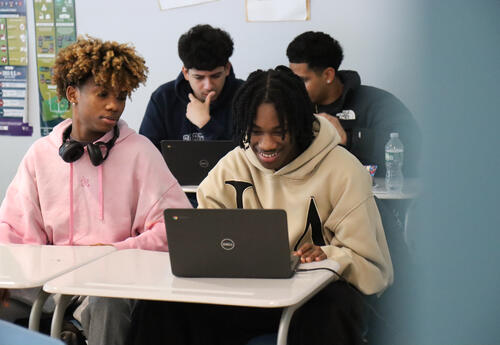 Students working on Chromebook