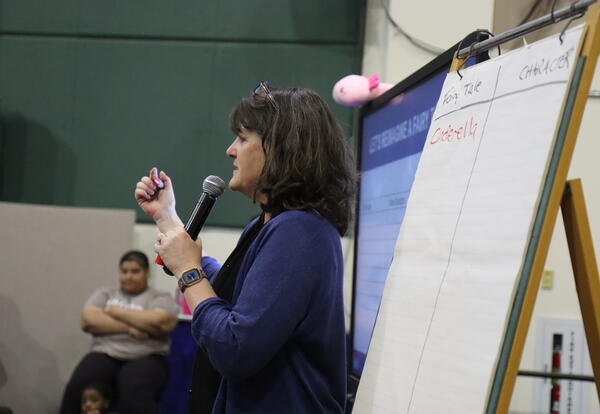 An author reads a story to students.