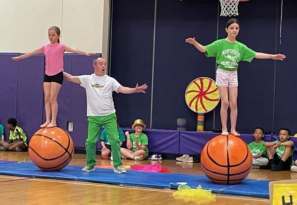 Students balance during a circus performance.