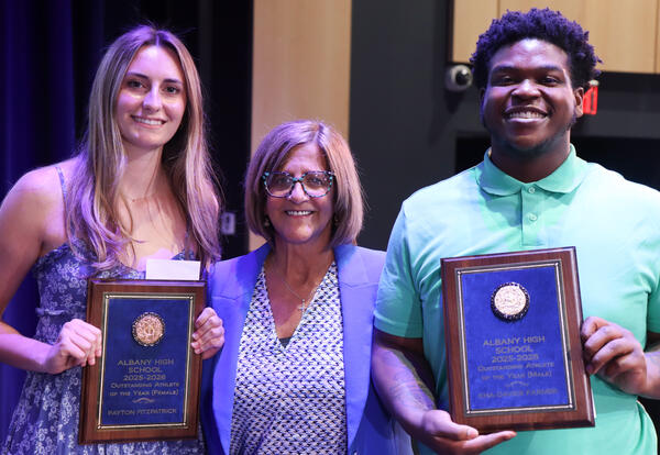 Photo of Payton Fitzpatrick, Kimberly Pilla and Kha'Davier Farmer at ceremony