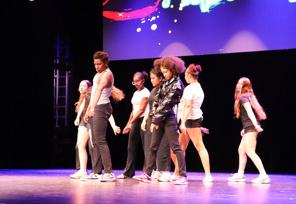 Photo of student dancers performing on stage