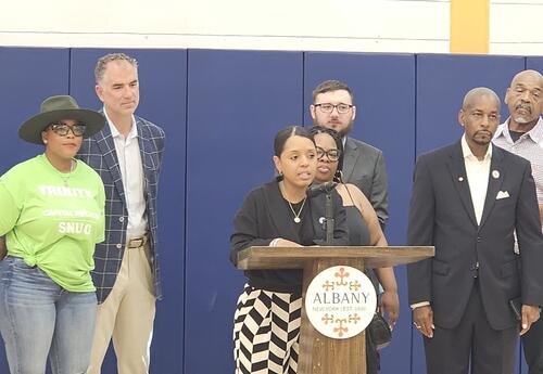 Superintendent Hochreiter, board member Wolfgang listen as Mayor Applyrs announces the new Summer Fun in Albany online resource