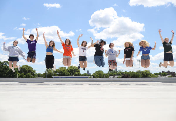 Top 10 students jumping in the air