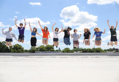 Top 10 students jumping in the air