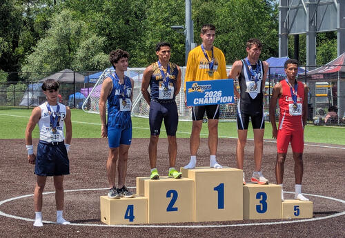 Bizer receiving medal on podium
