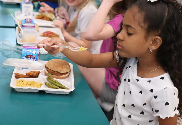 A student samples North African food.