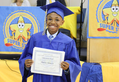 Photo of a student holding a certificate