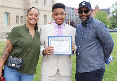 New grad poses family