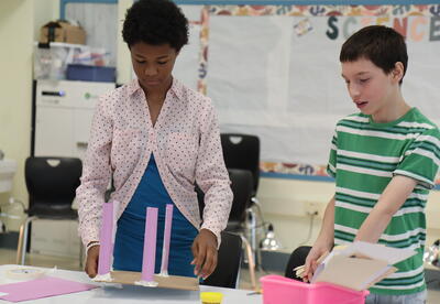 Students work on a STEM building project during summer programming.