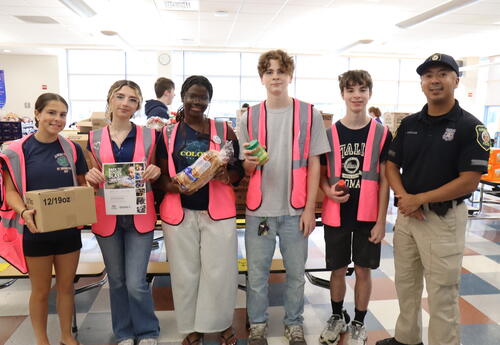 Students packing food bags with Albany Fund for Education