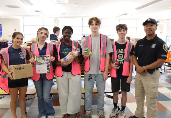 Students packing food bags with Albany Fund for Education